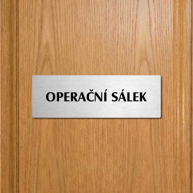 Operační sálek, 240x79mm, stříbrná popiska s okrasným rámečkem  